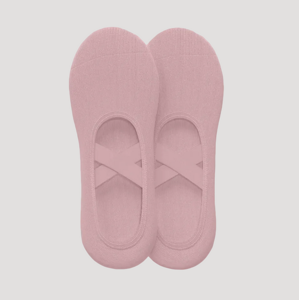 Pair of pink socks on a gray background